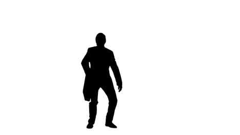 silhouette of a man in slow motion throwing a briefcase