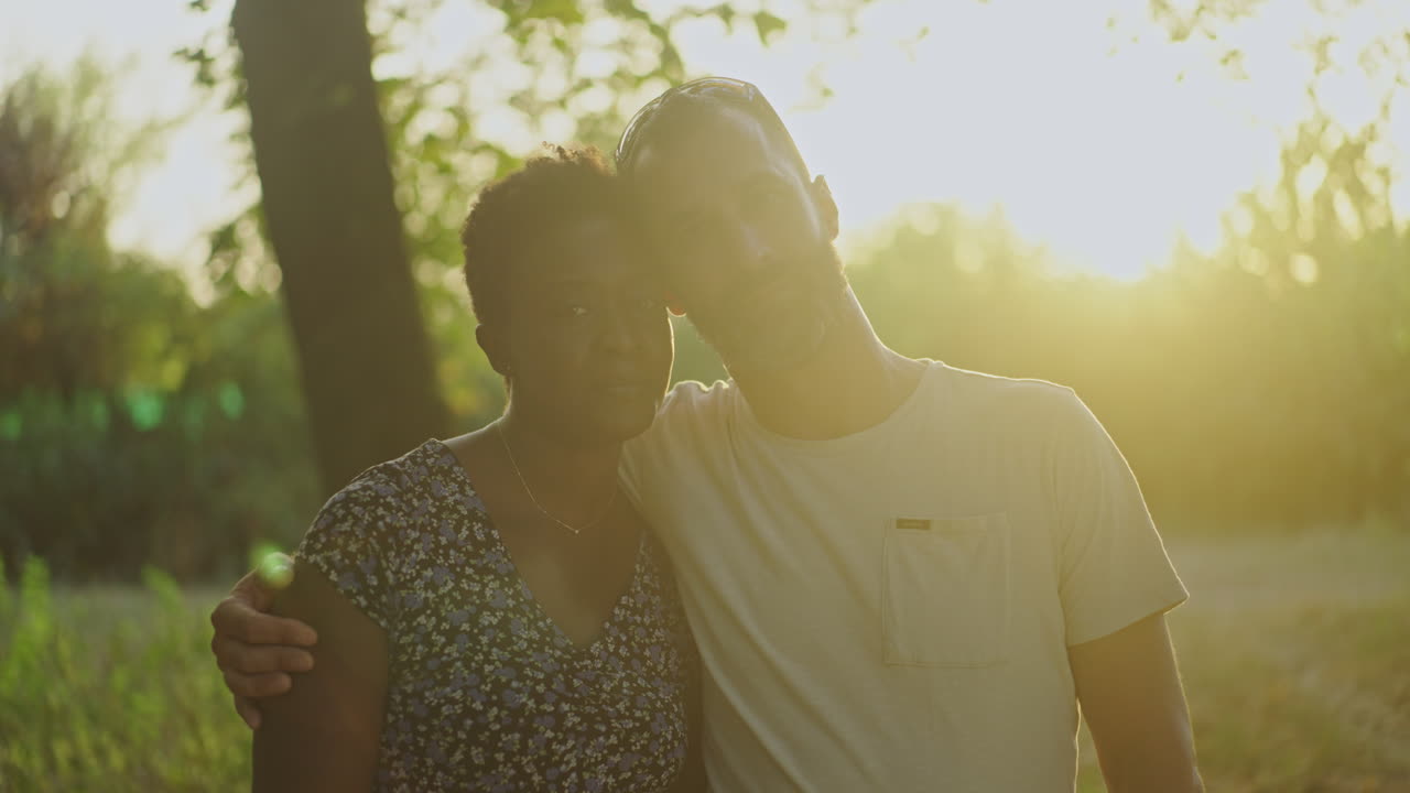 Couple posing for a portrait outdoors