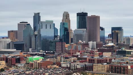 downtown minneapolis skyline with modern skyscrapers and historic buildings on a cloudy day