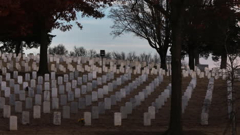 Aerial-lateral-shot-of-many-tombs-on-hill-at-Fayetteville-National-Cemetery,-America