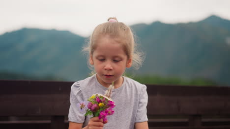 girl with allergy looks at windflowers sneezing near fence