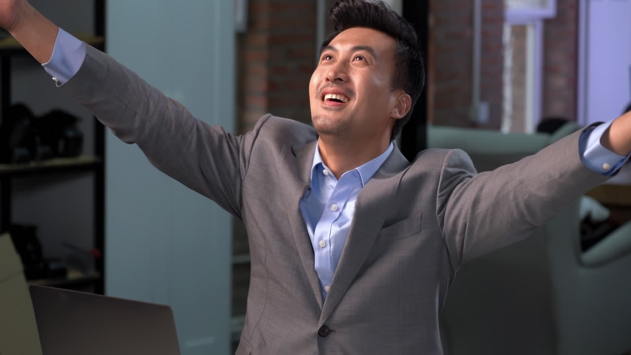 Smile asian businessman celebrating money rain falling money, winning or prize bonus promotion or success in office. Excited employee enjoying money. Happiness for victory profit of company.