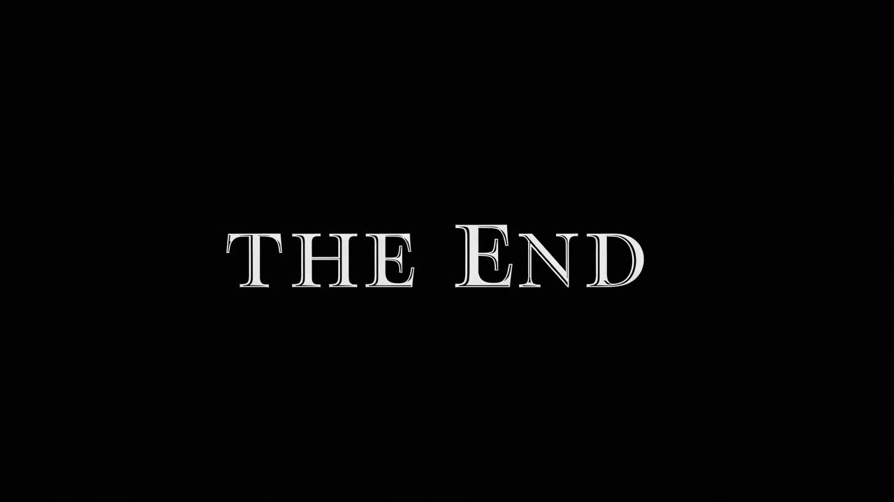 Classic 'The End' title card in a vintage video style, featuring bold white text on a black