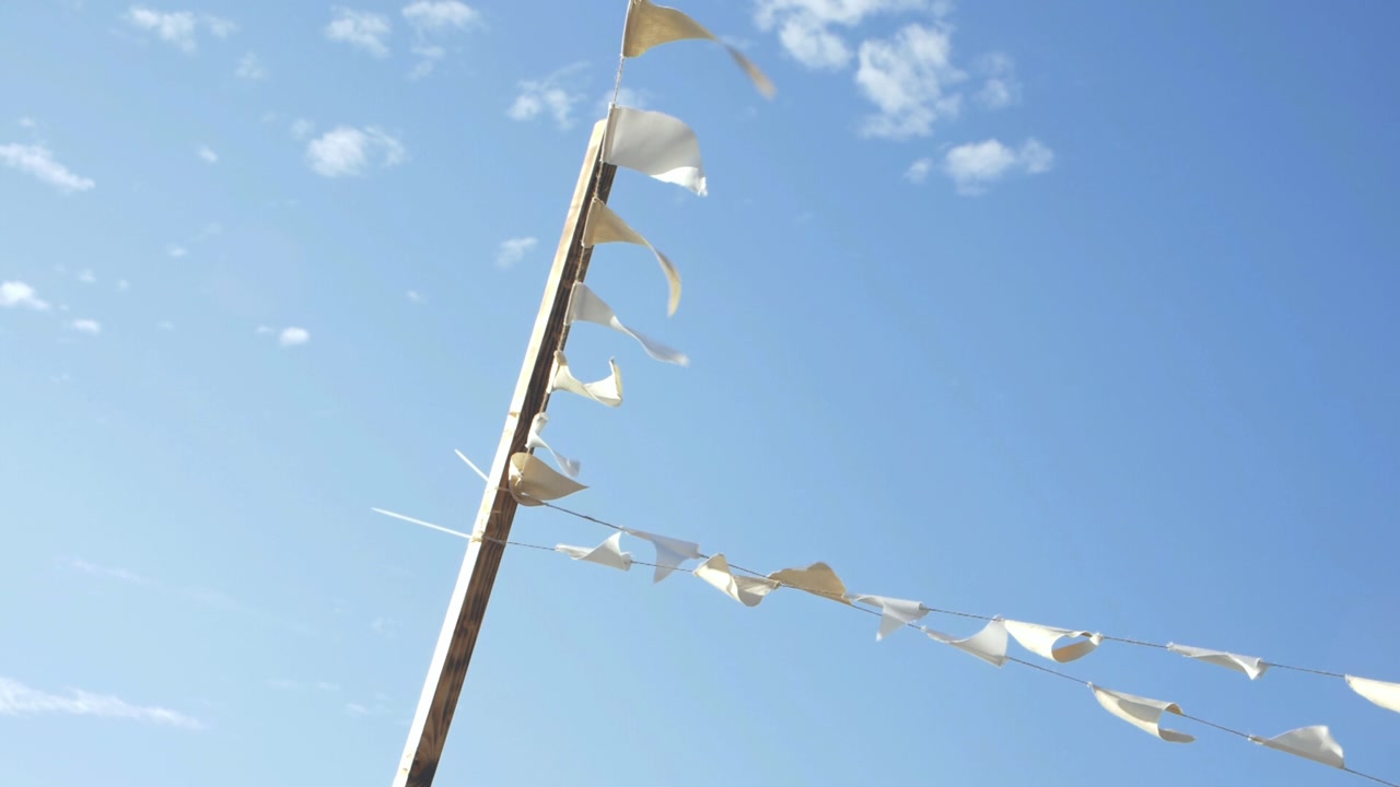 Beige Linen Bunting Decoration on Beach 4k