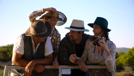 friends looking through binoculars during safari vacation 4k