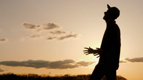 silhouette of a man at sunset