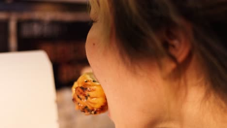 woman eating sushi