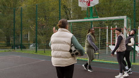 woman greeting friends outdoors