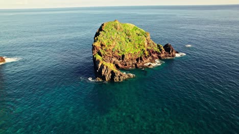 small volcanic island in the ocean