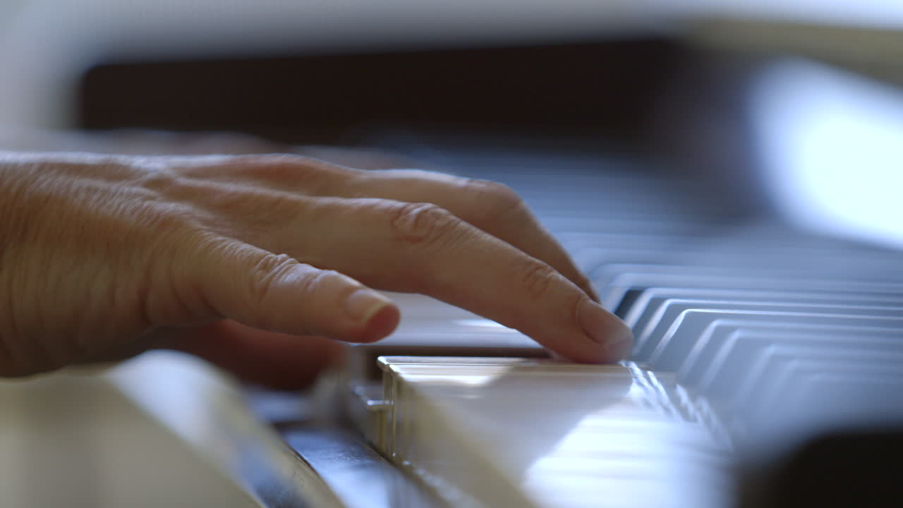 Fingers Of A Pianist Pressing On Black And White Piano Keys. Professional Musician Playing Piano. close up
