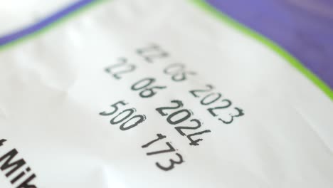 close up of a best by date on a food package