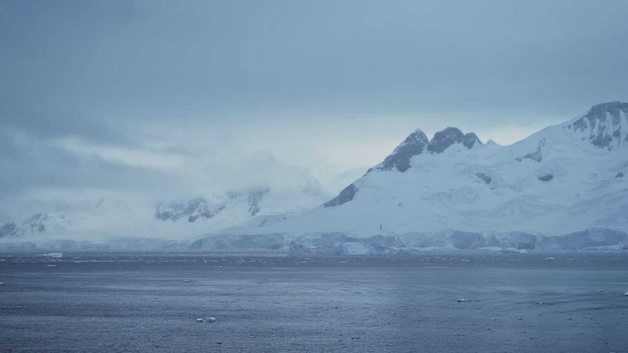 Winter Mountains and Glacier on Coast, Coastal Mountain Scenery in Antarctica, Cold Blue Landscape and Seascape with Glacier Ice and Ocean Sea Water, Antarctic Peninsula Dramatic Coastline Scene