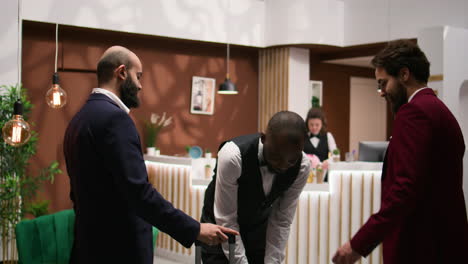 bellhop assisting guests after check in