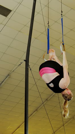 gymnast practicing with ring row