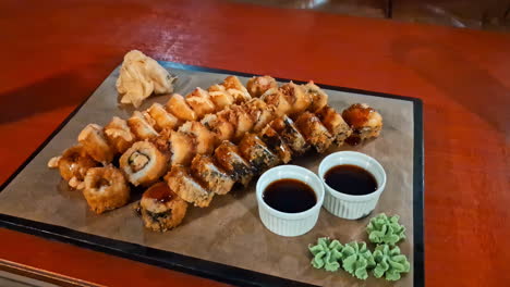 Delicious-fresh-sushi-plate-on-wooden-table,-zoom-in-view