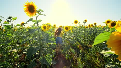 Girl Running Through a Sunflower Field