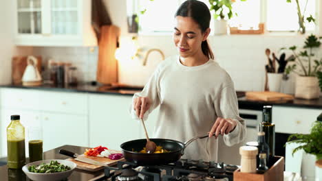 woman cooking healthy vegetables in the kitchen