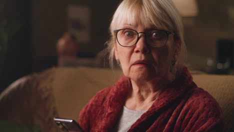 elderly woman using smartphone