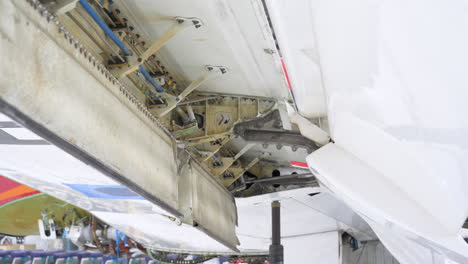 close up view under extended wing flap of an aircraft