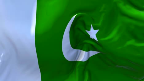 bandera de pakistán ondeando en el viento animación en cámara lenta. 4k textura de tela realista bandera soplando suavemente en un día de viento fondo de bucle continuo sin costuras.