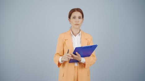 business woman alerting camera with stern expression.