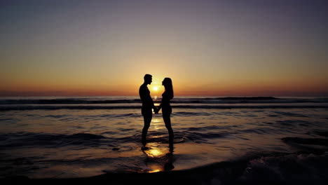 couple at sunrise on the beach