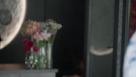 woman receiving a bouquet of flowers at a florist