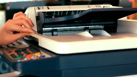 Executives-using-photocopy-machine-in-office