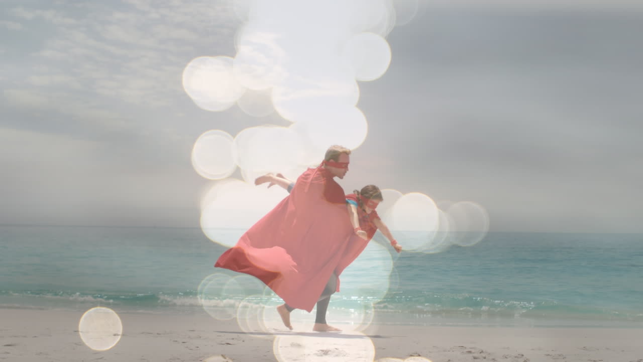 幸せな白人の父と息子がスーパーヒーローの服を着て楽しんでいるボケのアニメーション