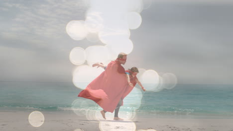 animación de bokeh sobre padre y hijo caucásicos felices divirtiéndose vestidos como superhéroes