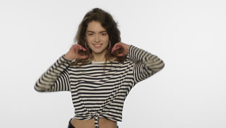 smiling woman dancing on white background