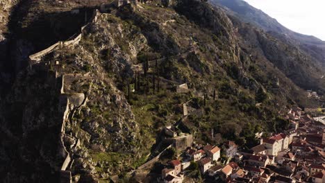 aerial - city walls of kotor, montenegro, a world heritage site, rising circle pan