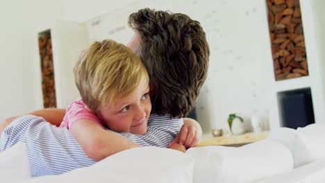 Happy-father-and-son-embracing-each-other-in-living-room-4k