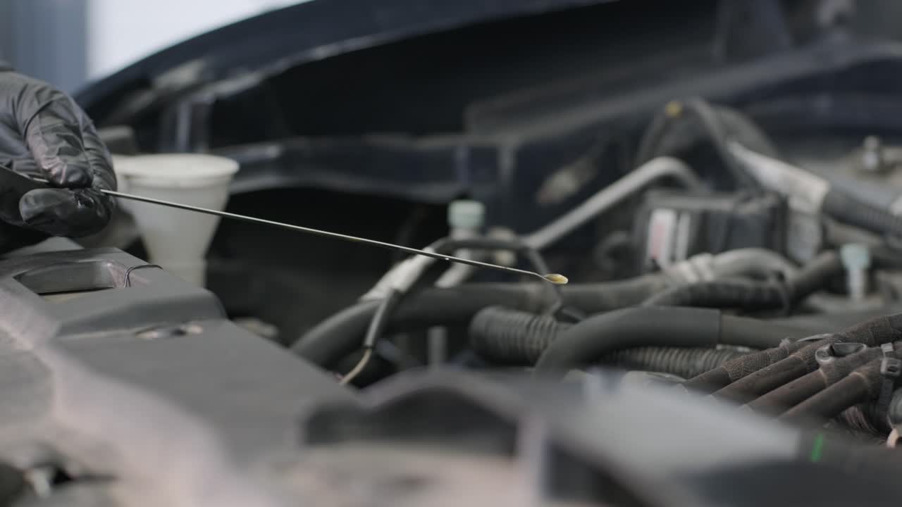 Checking Oil Level on a Car Engine