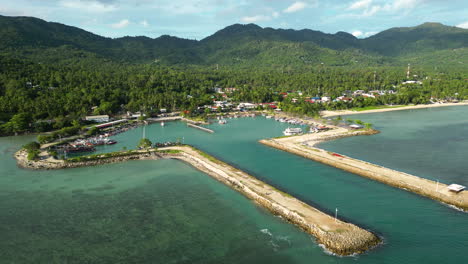 ban tai pier and tropical forest behind in thailand, aerial view