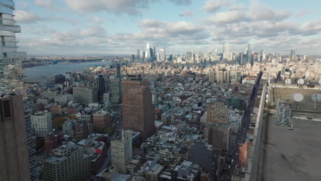 Panoramic-aerial-footage-of-cityscape.-Downtown-skyline-with-skyscrapers-in-background.-Manhattan,-New-York-City,-USA