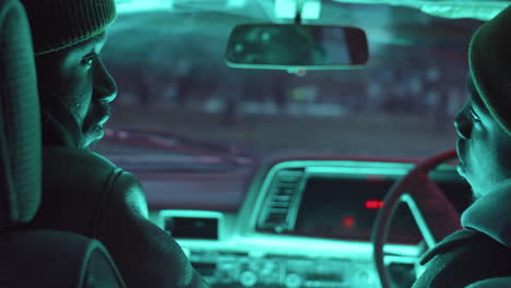 two african american men talking in car