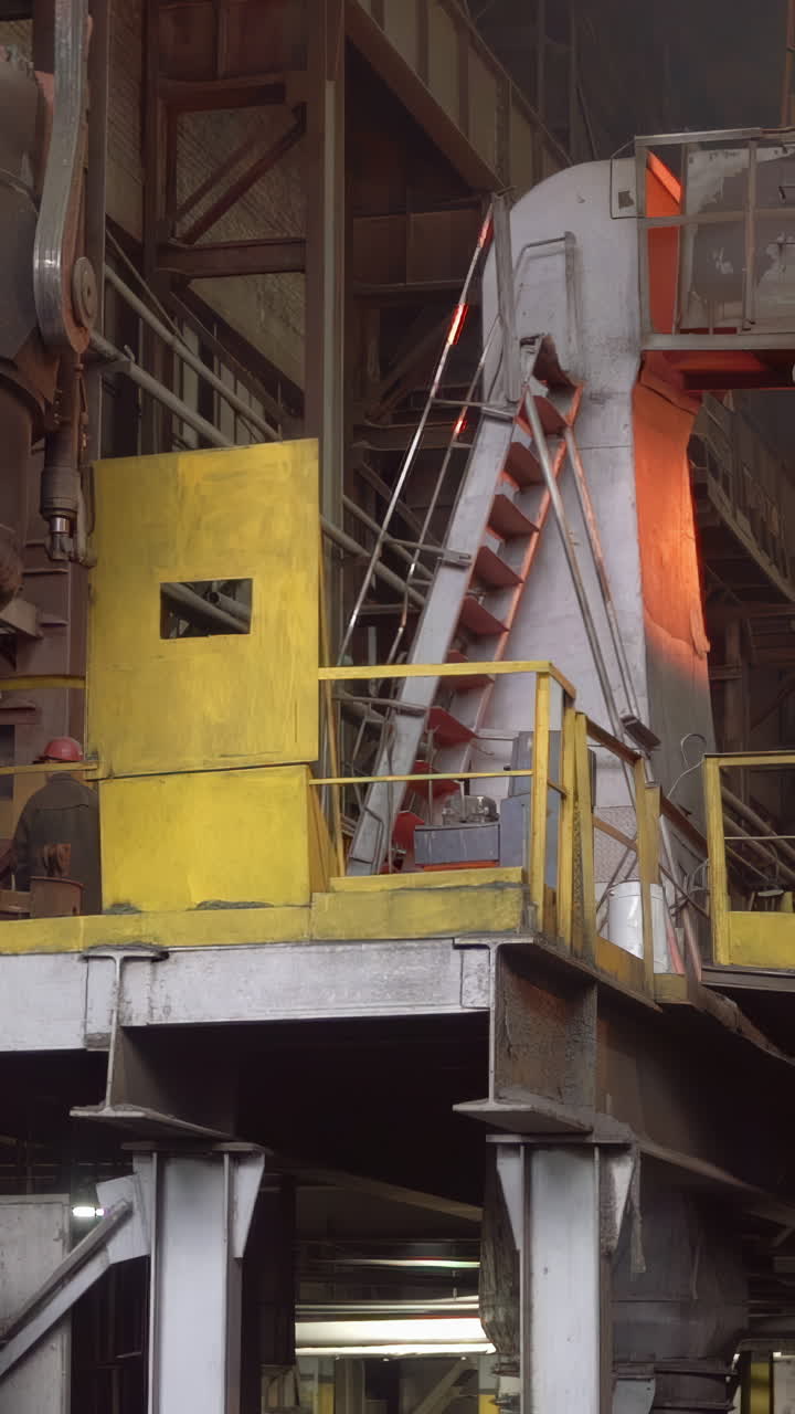 Industrial Steel Mill Operation with Worker and Hot Machinery