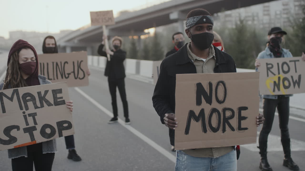 Protesters with signs demonstrating