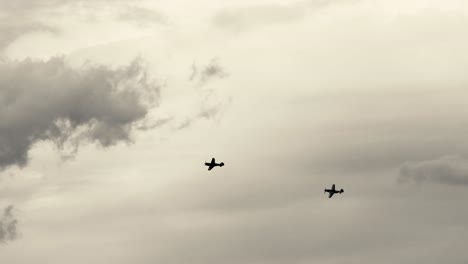 multiple planes flying in formation under overcast skies