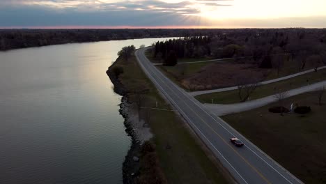red corvette driving into drone shot