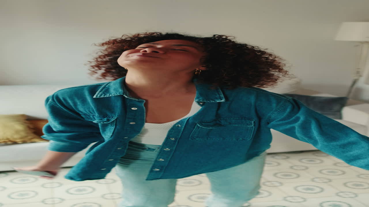 Happy Young Woman Stretching and Enjoying Her Morning Routine