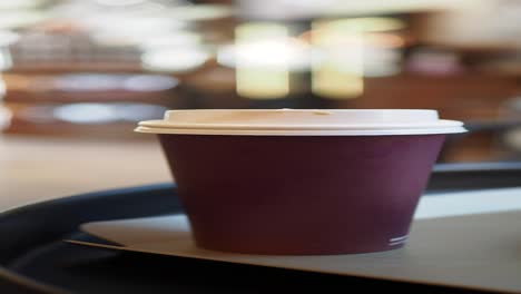 close-up of a cup of coffee on a cafe table