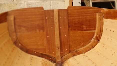 oiled wooden transom of traditional wooden boat