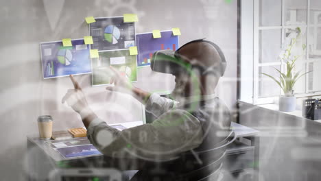 animation of data processing and social media icons over african american man wearing vr headset