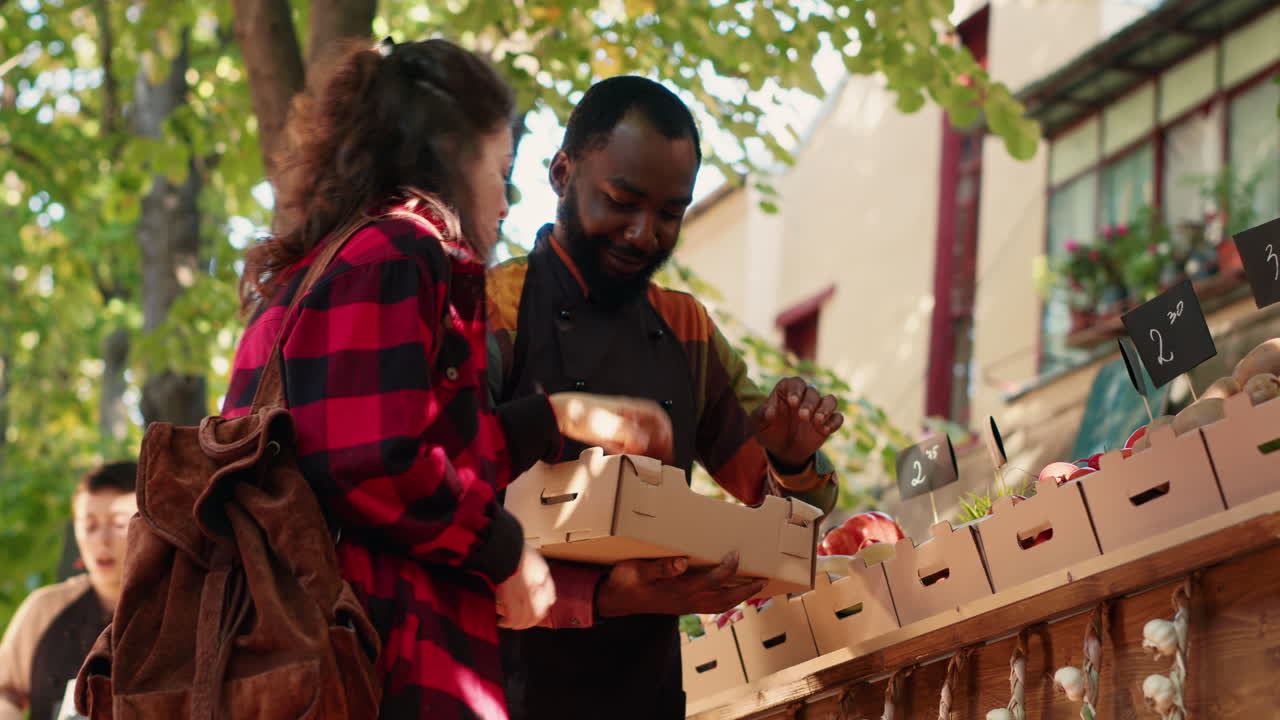 People shopping at a fruit stand