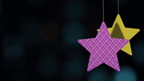 christmas star ornaments are swinging on bokeh background loopable file