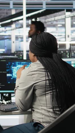 vertical video data center staff member in office using ai deep learning algorithms