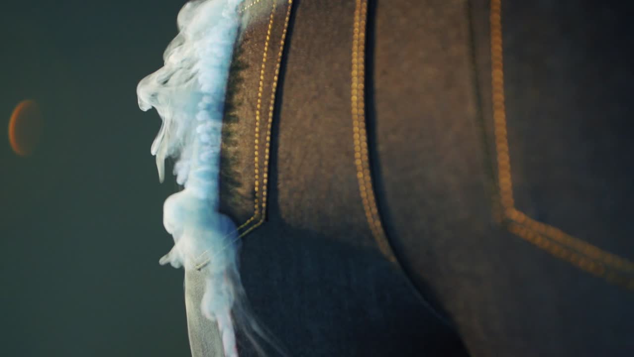 denim factory using laser beams to make design on blue jeans