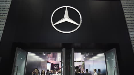 visitors walking in and out of the gate to the mercedes-benz pavilion at 2019 international auto show in shenzhen, china. june 1, 2019.